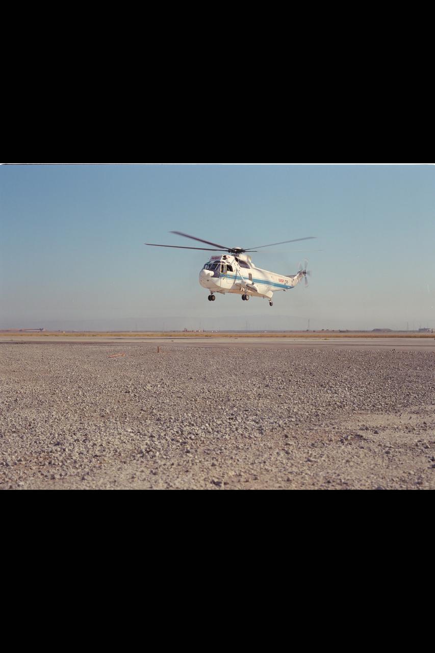 SH-3G (NASA-735) Helicopter in flight.