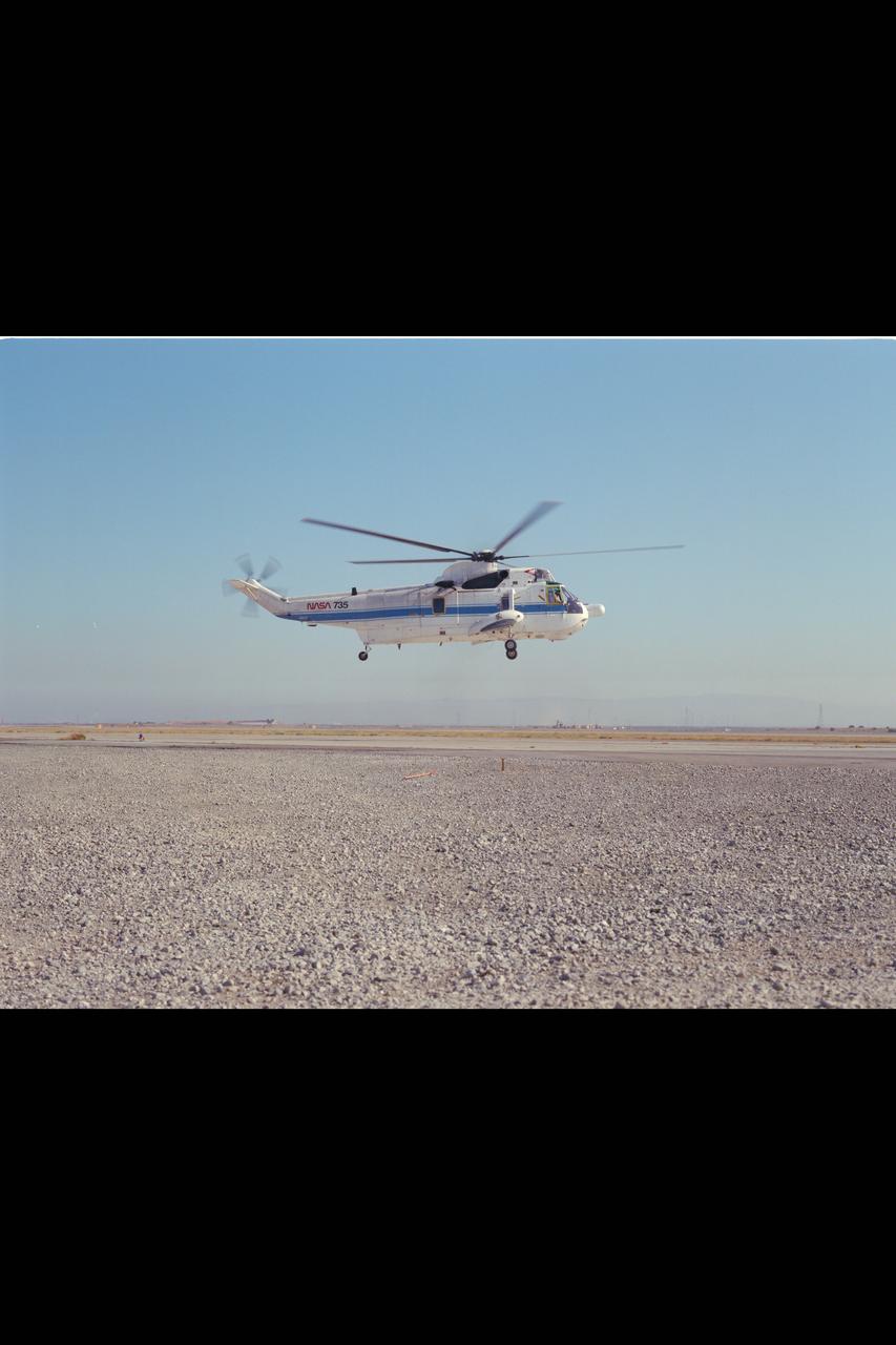 SH-3G (NASA-735) Helicopter in flight.
