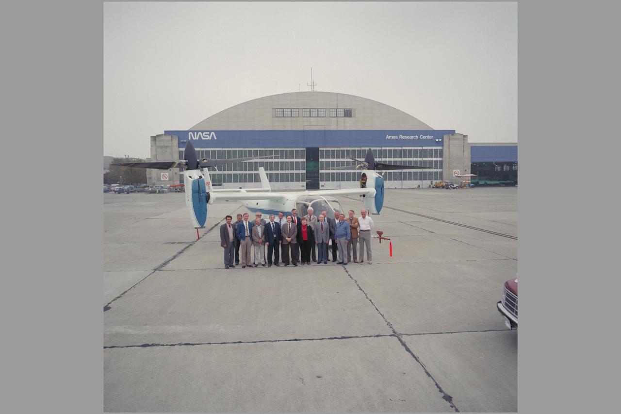 XV-15 PROJECT TEAM.  AEROSPACE SYSTEM DIVISION (CODE F) & FLIGHT OPERATIONS & RESEARCH (CODE O) PERSONNEL  Front row: Mike Bondi, Dan Dugan. Shorty Schroers, Wally Deckert, Marty Maisel, Violet Lamica, Robby Robinson, Demo Giulianetti. Back row: Jerry Bree, Gary Churchill, Dave Few, Jerry Barrack, Kip Edenborough, Jim Lane, Mike Carness, Dave Chappel, Duane Allen, Not pictured: Woody Cook, Jim Weiberg, Dean Borgman, Jim Brown, John Hemiup, Al Gahler, Ron Gerdes, Cliff Mckiethan, Bill Snyder, Rick Simmons Note:  Used in publication in Flight Research at Ames;  57 Years of Development and Validation of Aeronautical Technology NASA SP-1998-3300 fig 123
