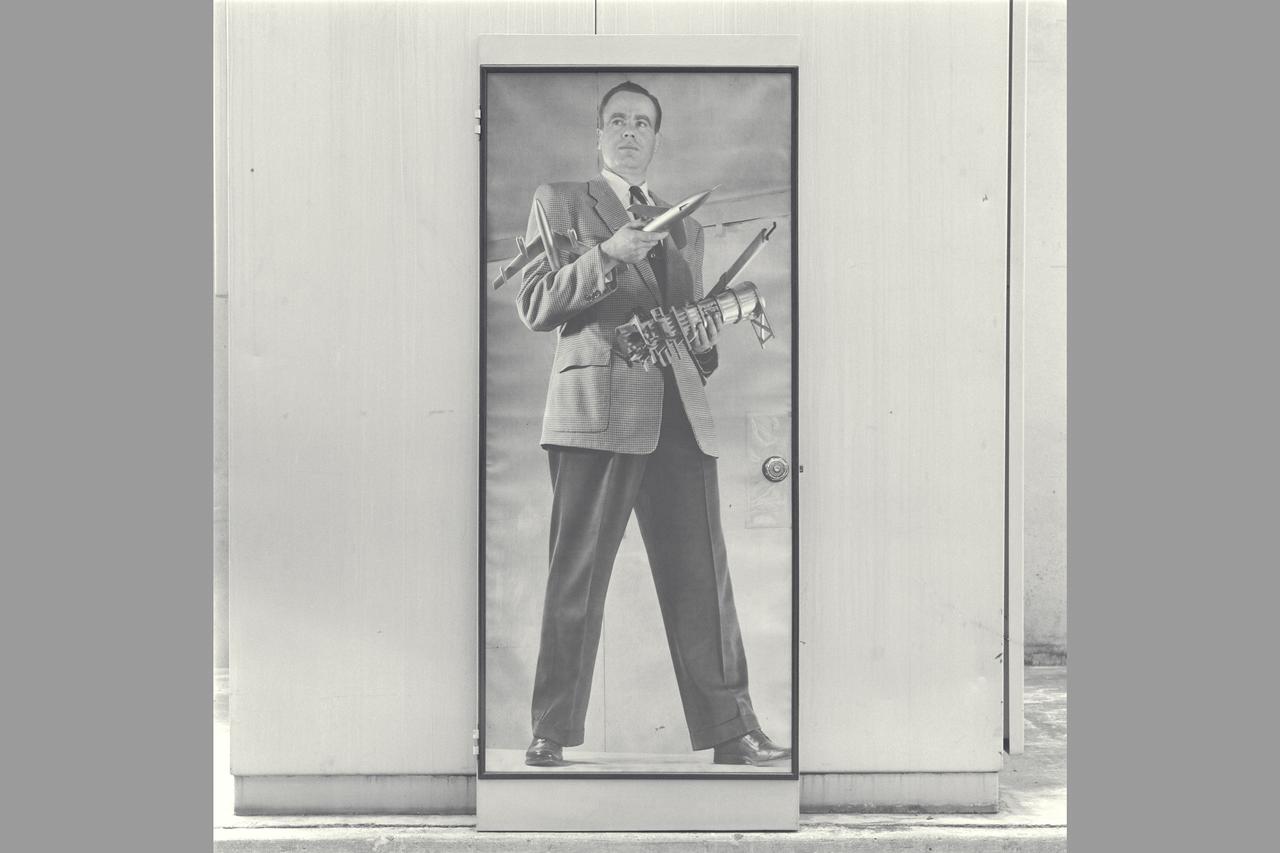 Historical Recruiting poster of Cleve E Voss  holding model of B-47, Douglas D-558-2, 6x6ft w.t. & slide rule (on Display at Macy's San Francisco 1947 - 1950 ish)  NOTE: Poster recovered from Voss's wife and copied from the (bedroom) door to which it had been adhered.