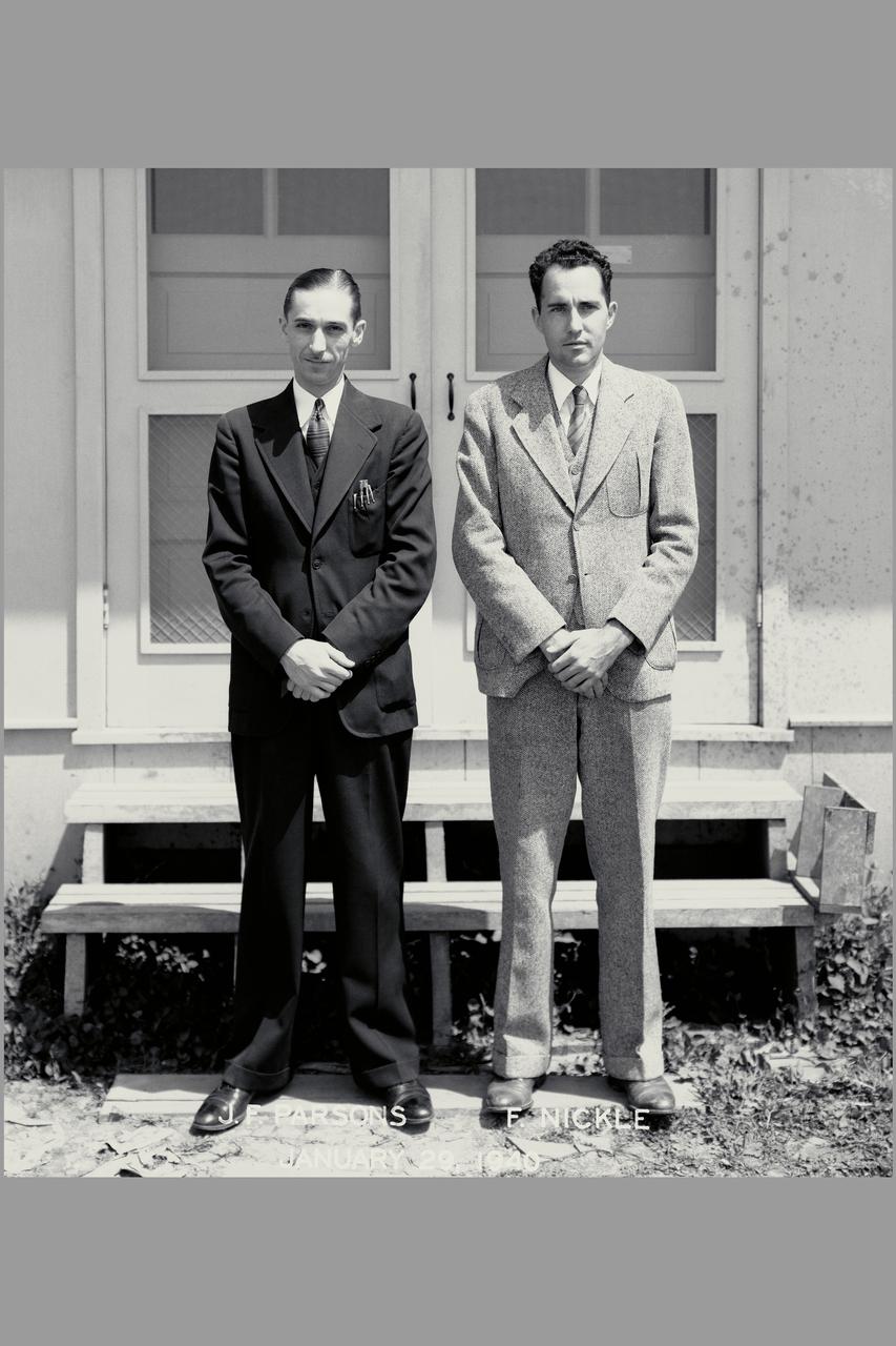 First members of the Ames staff: John F Parsons (left) and Ferril R. Nickle (right) standing in front of construction shack.