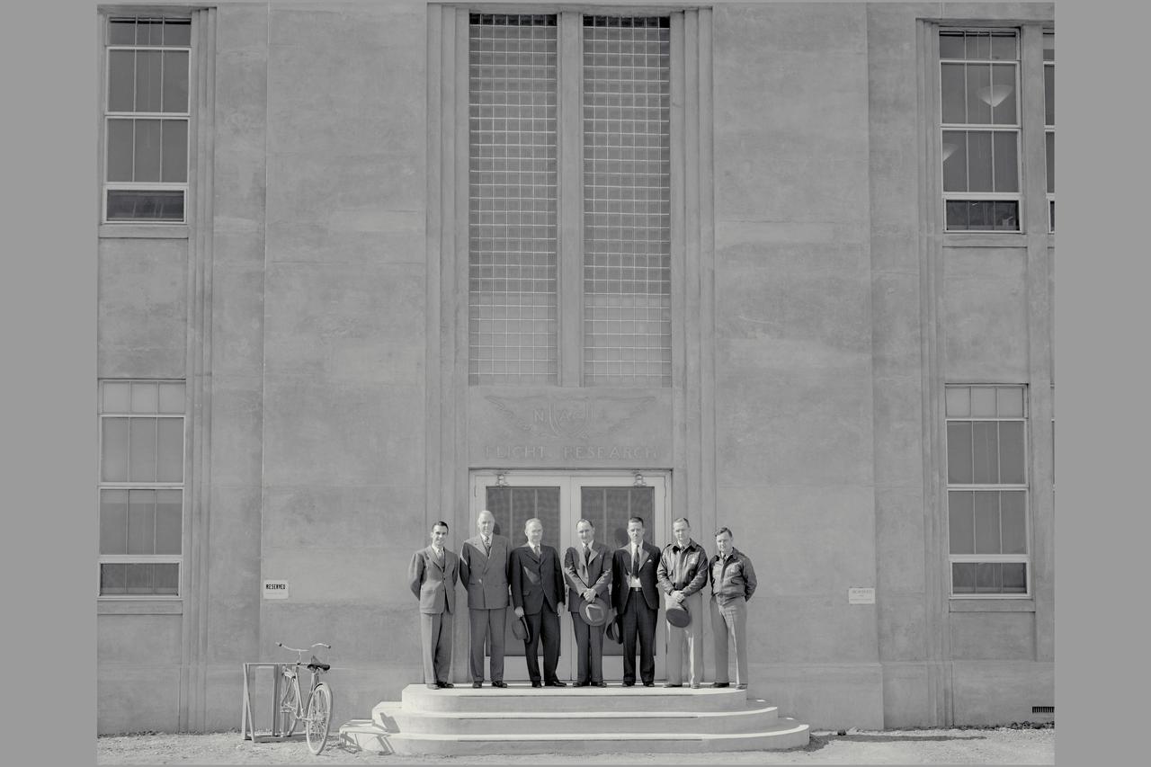 Dr Mead and Members of staff in front of Flight Research Lab building