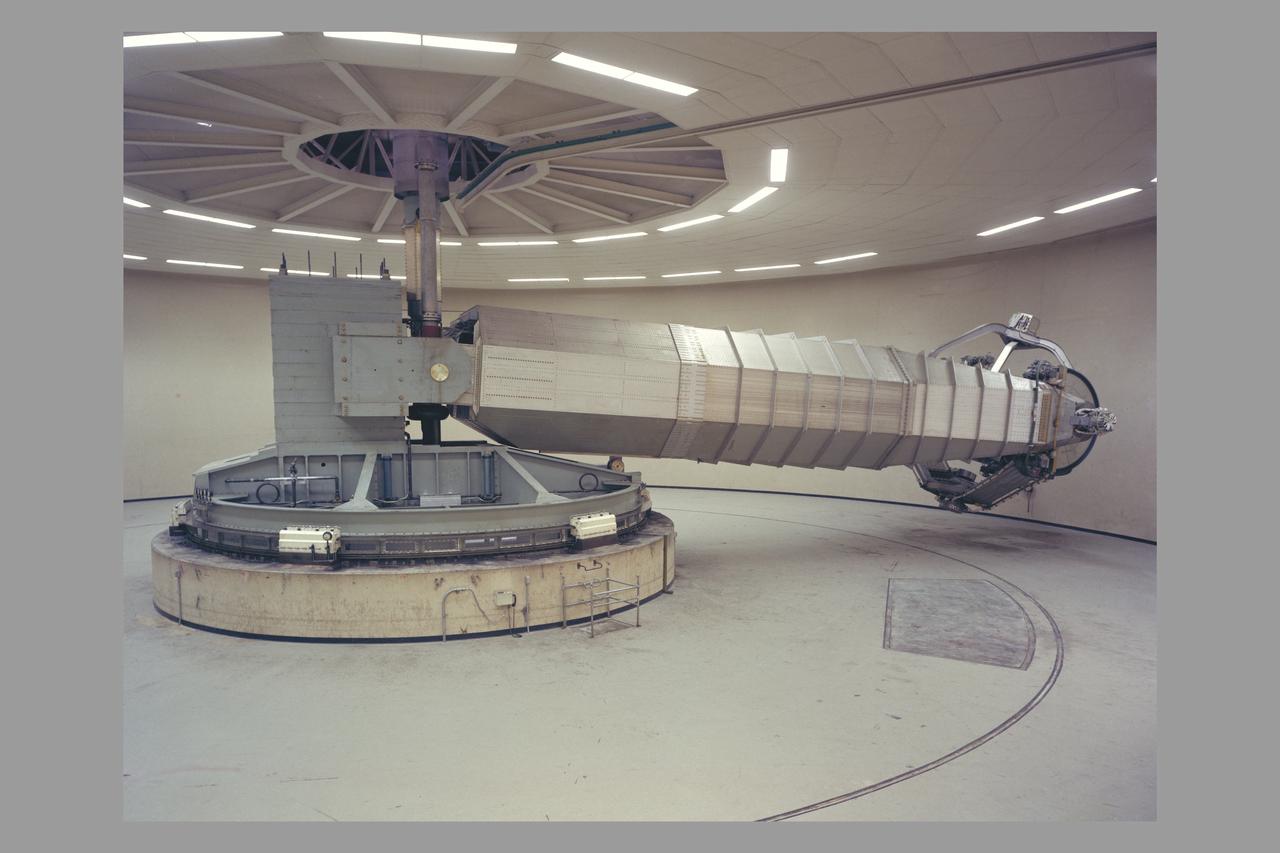 N-243 Flight and Guidance Centrifuge: Is used for spacecraft mission simulations and is adaptable to two configurations.  Configuration 1: The cab will accommodate a three-man crew for space mission research. The accelerations and rates are intended to be smoothly applicable at very low value so the navigation and guidance procedures using a high-accuracy, out-the window display may be simulated.  Configuration 2: The simulator can use a one-man cab for human tolerance studies and performance testing. Atmosphere and tempertaure can be varied as stress inducements.  This simlator is operated closed-loop with digital or analog computation. It is currently man-rated for 3.5g maximum.