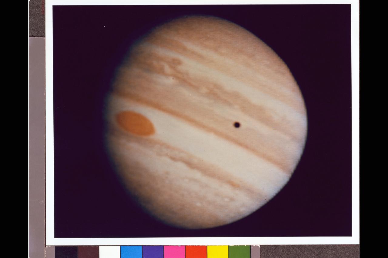 Photograph take Pioneer 10 spacecraft managed by the NASA Ames Research Center, Moffett Field, California Jupiter's Red Spot and a showdow of the Moon, Io are seen in this image taken at a range of 2527063km. This photo has been enhanced from the raw data received from the spacecraft.