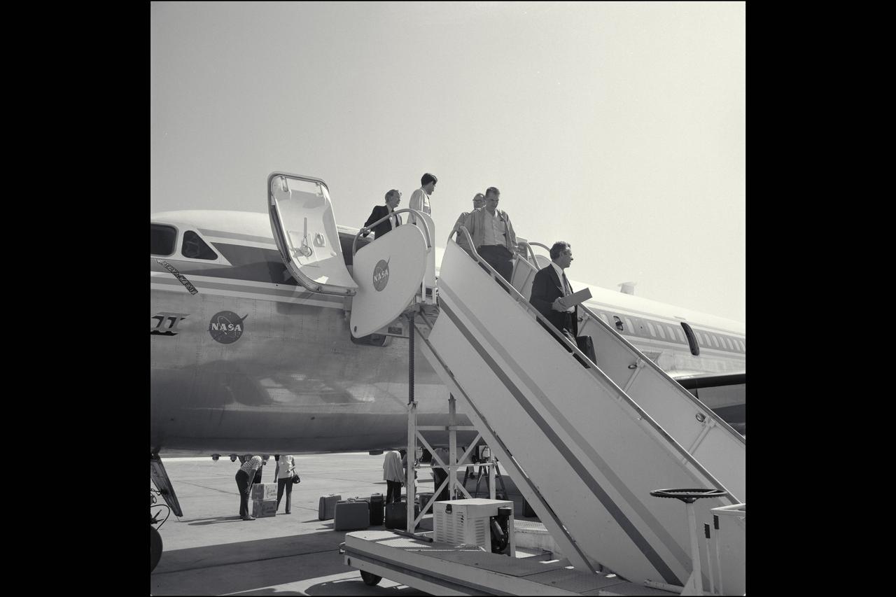 CV-990 Galileo II arrival at Ames after first expedition - decending ramp are from top Don Anderson, Mike Bader, Dean Chapman (?), Hans Mark and unknown