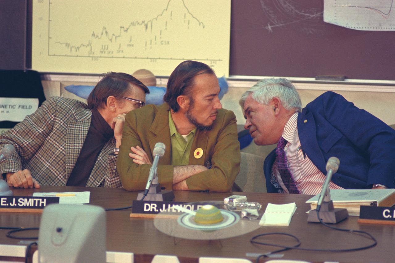 Dr E. J.Smith, John Wolf (Ames) and Charles Hall (Ames) confer during press conference for Pioneer 11 Jupiter encounter