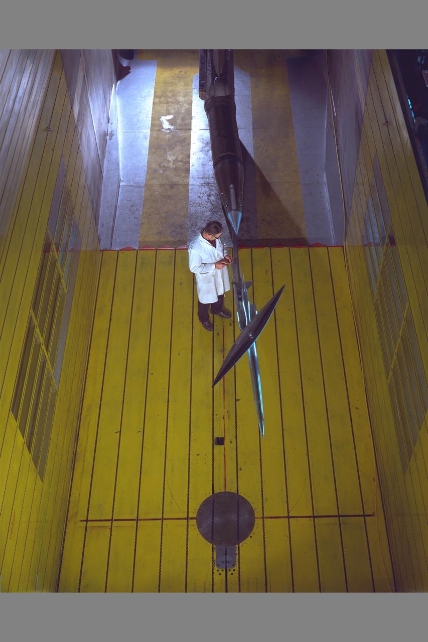 Practical Oblique Wing Test-026) in 11ft w.t. overhead view with technician
