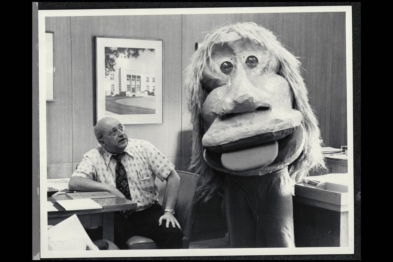 Ames Center Director receives visitors during the Halloween parade