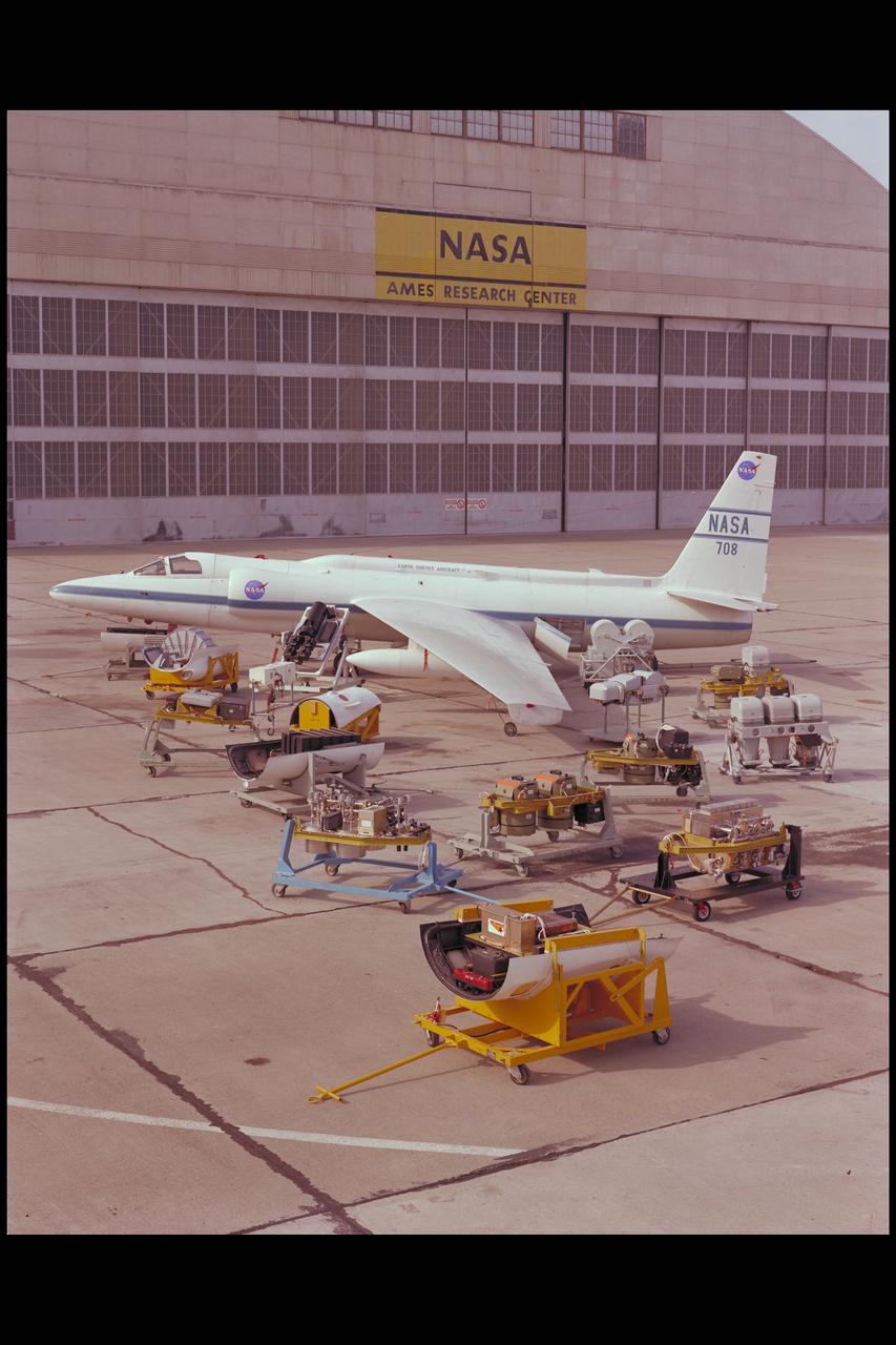 The U-2 Earth Resources Aircraft on the Ames tarmack surrounded by the on board sensors and camera systems