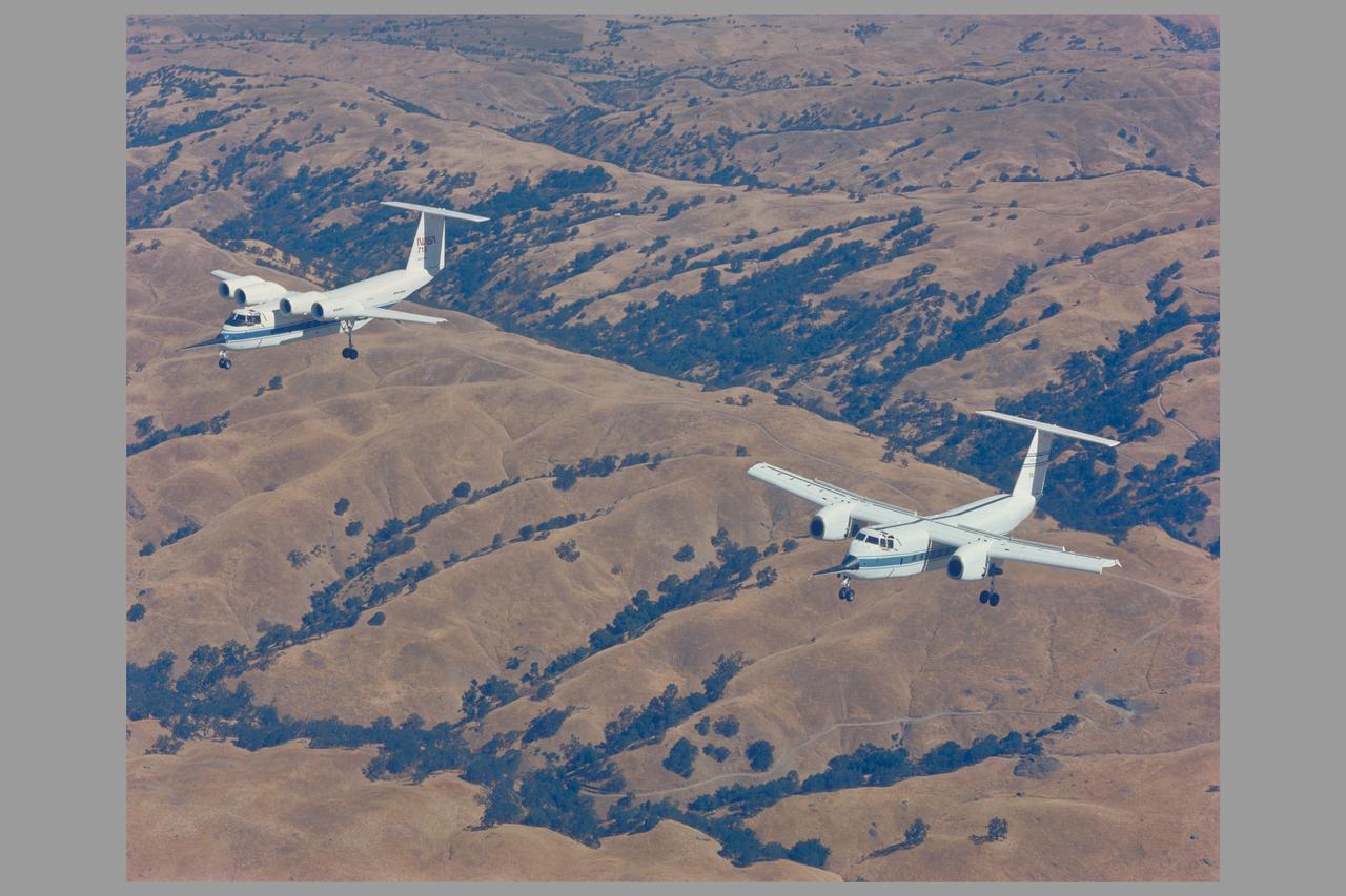Air to air of the QSRA (NASA 715) and C-8A (NASA 716) on maiden flight to Ames from Seattle, Washington after coversion