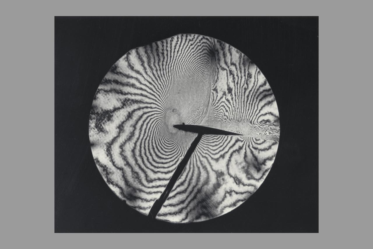 Interferogram of Transonic flow field - reconstructed laser hologram as an infinite-fringe interferogram shows shock-wave shape, location and separaton of the airfoil boundry layer