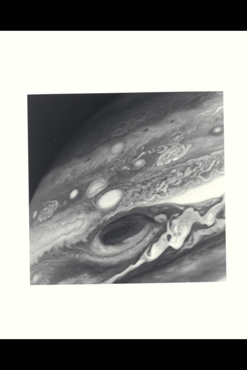 Range : 9.2 million kilometers (3.7 million miles) This photo shows Jupiter's Great Red Spot and its surroundings.  Shown is cloud detail that is 100 miles (160 km) across.  The colorful, wavy cloud pattern to the left of the Red Spot is a region of complex and variable wave motion.  Photo taken through a violet filter.