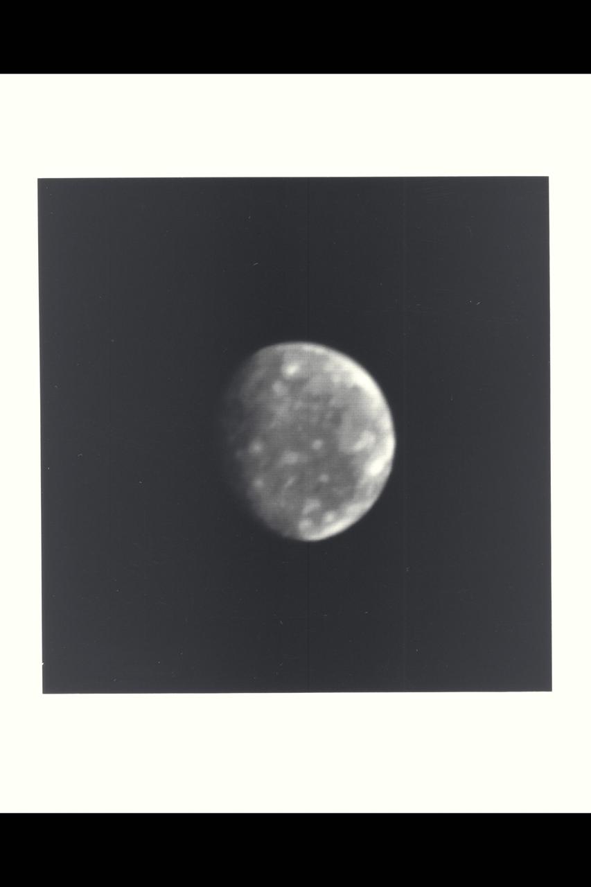 This photo of Callisto, outermost of Jupiter's four Galilean satellites, was taken a few minutes after midnight (PST) Feb. 25 by Voyager 1.  The distance to Callisto was 8,023,000 kilometers (4.98 million miles).  The hemisphere in this picture shows a fairly uniform surface dotted with brighter spots that are up to several hundred kilometers across.  Scientists believe the spots may be impact craters but higher-resolution photos will be necessary before the features can be interpreted.  Callisto is about the same size as the planet Mercury--about 5,000 kilometers (3,000 miles) in diameter.  Callisto is less massive than Mercury, however, giving it a density less than twice that of water.  Scientists believe Callisto, therefore, is composed of a mixture of rock and ice (up to about 50 percent by weight).  Its surface is darker than those of the other Galilean satellites, but is still about twice as bright as Earth's Moon.  This black-and-white photo was taken through a violet filter.  Jet Propulsion Laboratory manages and controls the Voyager project for NASA's Office of Space Science. (JPL ref. No. P-21149)