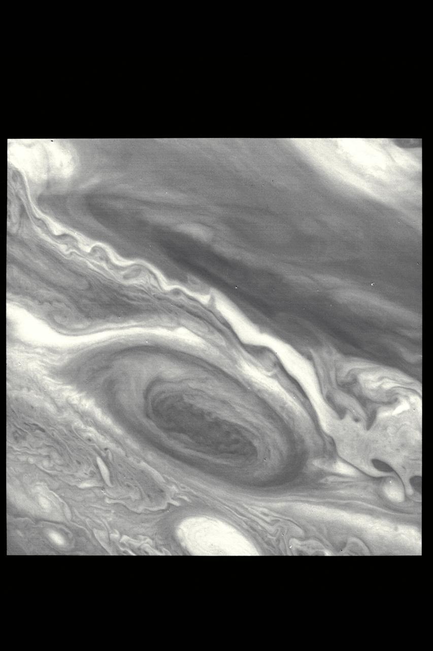 P-21736 BW This Voyager 2 pictures shows the Great Red Spot and the south equatorial belt extending into the equatorial region. At right is an interchange of material between the south equatorial belt and the equatorial zone. The clouds in this zone are more diffuse and do not display the structures seen in other locations. Considerable structure is evident within the Great Red Spot.