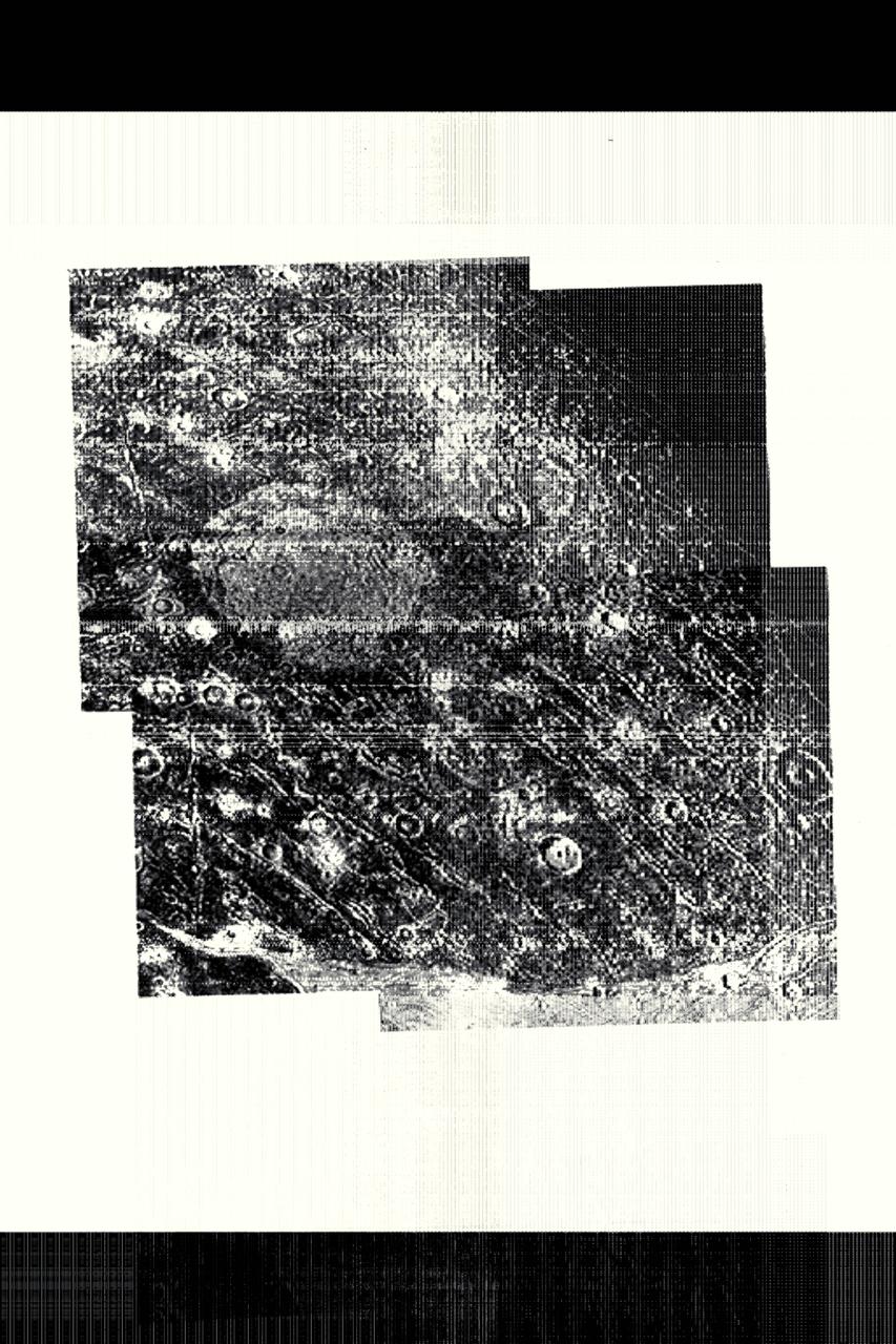 Range :  85,000 kilometers (53,000 miles) This photo of Jupiter's satellite Ganymede shows ancient cratered terrain.  A variety of impact craters of different ages are shown.  The brightest craters are the youngest.  The ejecta blankets fade with age.  The center shows a bright patch that represents the rebounding of the floor of the crater.  The dirty ice has lost all topography except for faint circular patterns.  Also shown are the 'Callisto type' curved troughs and ridges that mark an ancient enormous impact basin.  The basin itself has been destroyed by later geologic processes.  Only the ring features are preserved on the ancient surface.   Near the bottom of the picture, these curved features are trumcated by the younger grooved terrain.
