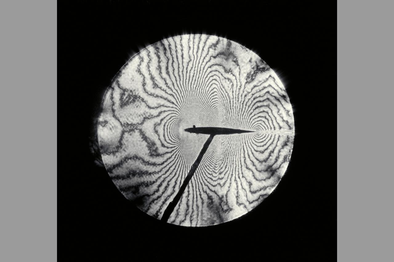 Interferogram of Transonic flow field - reconstructed laser hologram as an infinite-fringe interferogram shows shock-wave shape, location and separaton of the airfoil boundry layer
