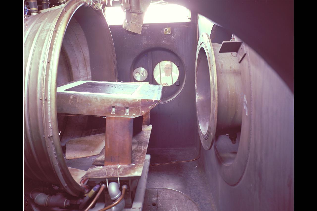 N-238 60MW Aerodynamic Heating Facility set up for TPS testing with T. Asta looking on through test section viewing window.