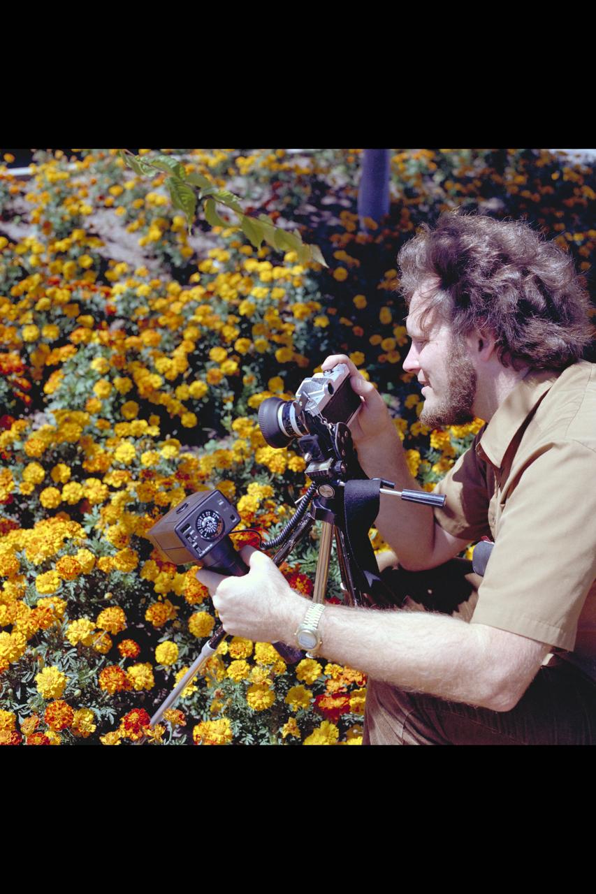 Recruiting Brochure: Ames employee and amateur photographer John Wallace uses base flower gardens as subject of his interest.