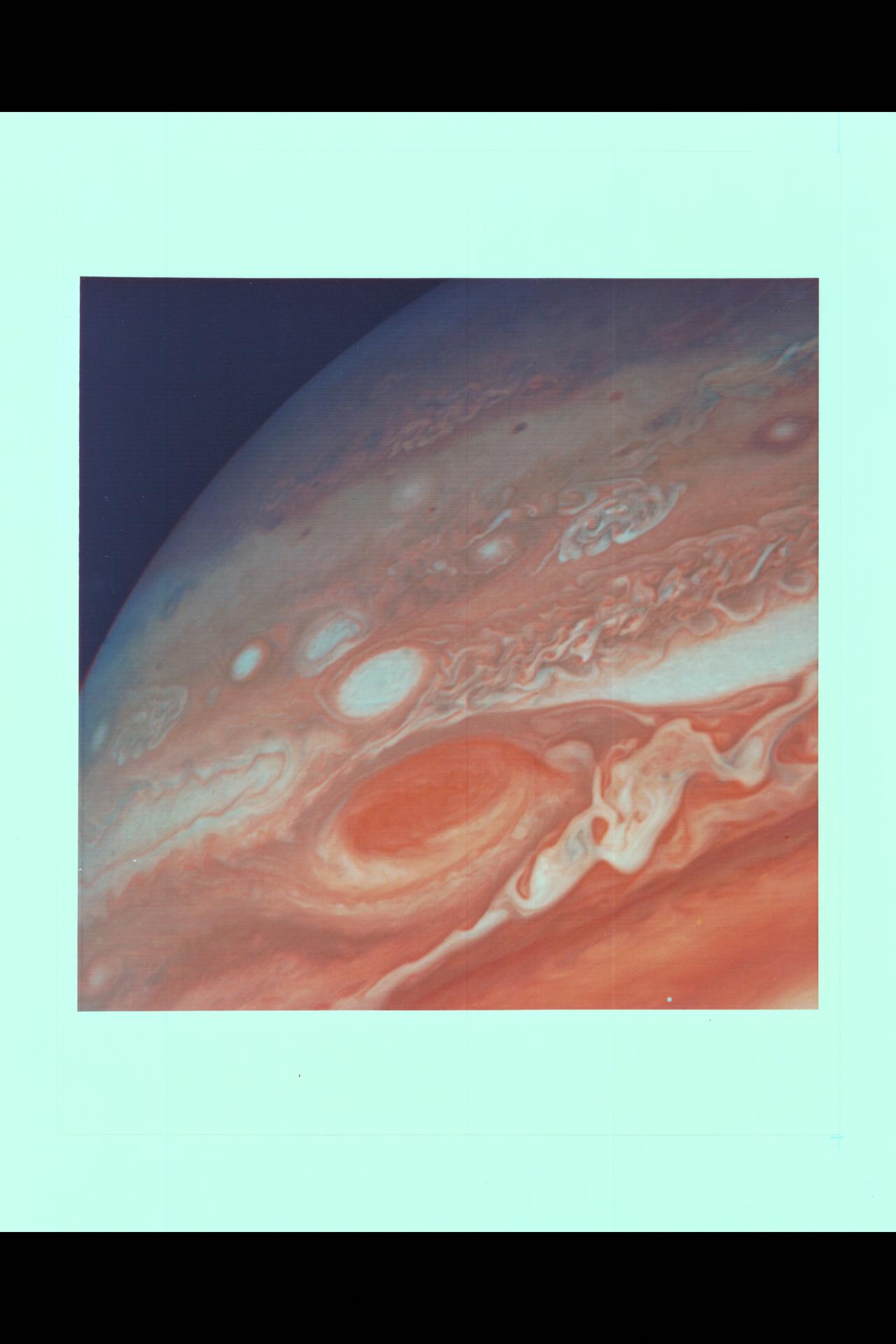 Range :  5.7 million miles(9.2 million kilometers) Image shows Jupiter's Great Red Spot and surroundings.  Cloud detail as small as 100 miles (160 kilometers) across can be seen.  Colorful, wavy cloud pattern left of the Red Spot is a region of complex and variable wave motion.