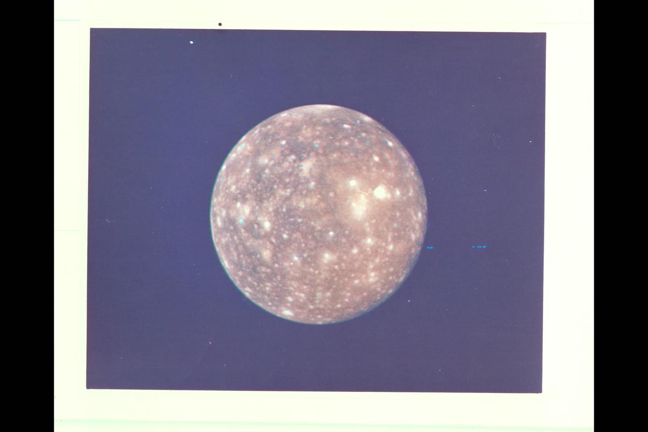 P-21740 C Range: 2,318,000 kilometers (1,438,000 miles) This picture of Callisto taken by Voyager 2 shows the moon covered with bright spots which are metoerite impact craters--a fact originally discovered from the high resolution pictures taken by Voyager 1. Scientists believe that heavily cratered terrains like these on Callisto are indicative of ancient planetary surfaces. Voyager 2 mapped the side of Callisto not seen by Voyager 1. The obsure dark streaks in this area may be fault zones, but higher resolution pictures are needed for identification.