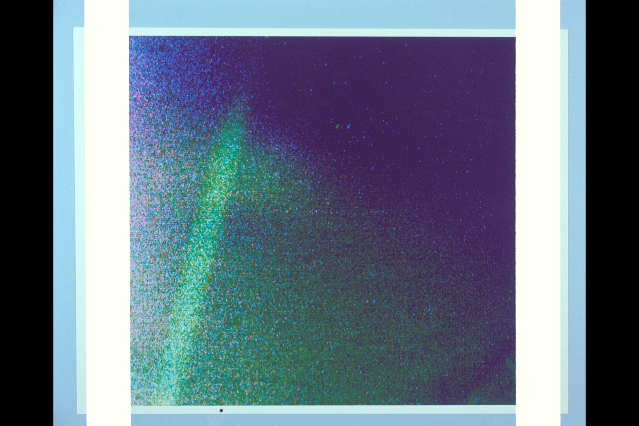 P-21763 C Range: 1,400,000 kilometers (870,000 miles) Jupiter's thin ring of particles was photographed by Voyager 2's telescope-equipped TV camera through three color filters to provide this color representation. During the three long exposures the spacecraft drifted, smearing out the ring image. The linear feature just above the ring is a star trail. True color of the ring cannot be deduced from this photo.