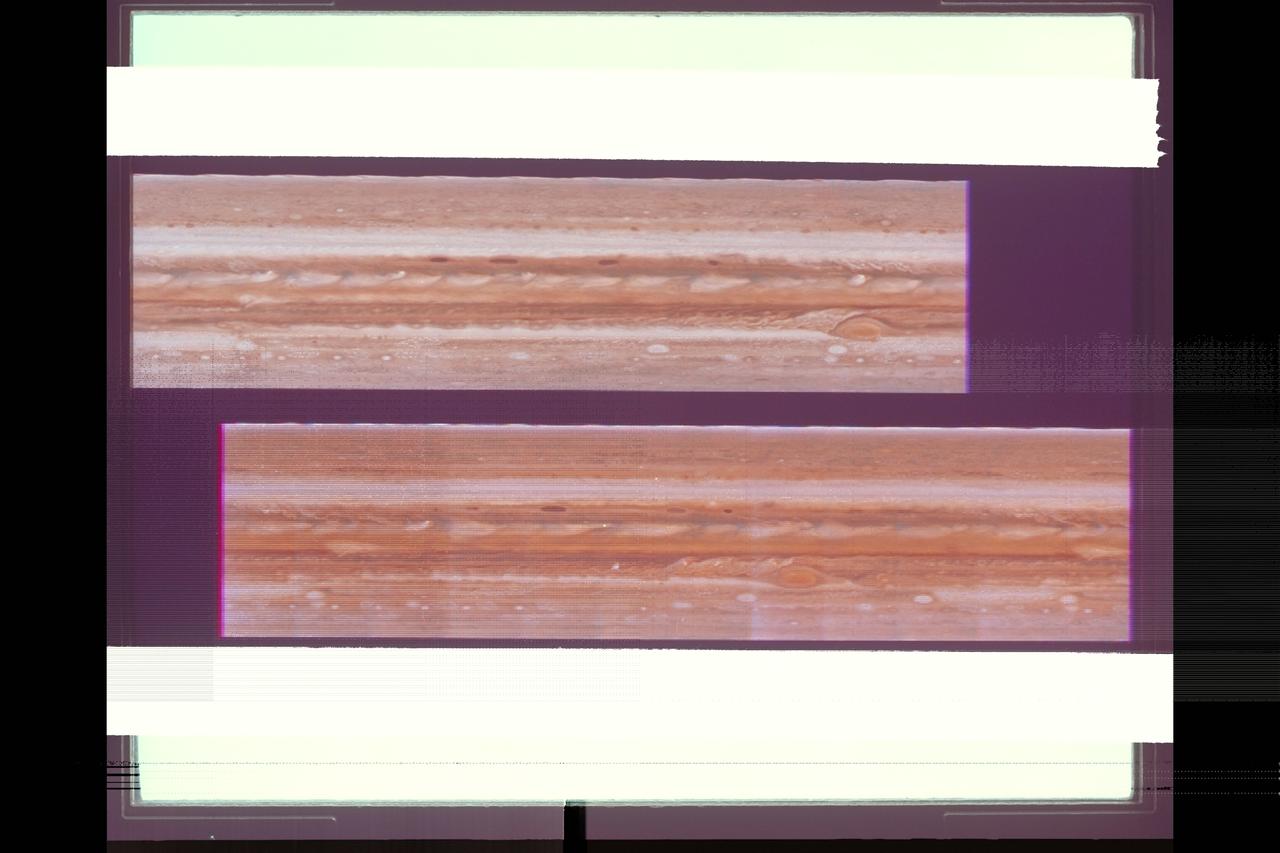 The cylindrical projections of Jupiter, representing both Voyager 1 (top) and Voyager 2 (bottom), are presented in this comparison.  The top picture extends 400 degrees longitude to 0 degrees (right edge).  It is aligned with the lower image so that the longitude scale is correct for both frames.  The comparison between the pictures shows the relative motions of features in Jupiter's atmosphere.  It can be seen that the Great Red Spot has moved westward and the white oval features eastward during the time between the acquisition of these pictures.  Regulare plume patterns are equidistant around the northern edge of the equator, while a train of small spots has moved eastward at approxiamately 80 degrees south latitude.  In addition to these relative motions, significant changes are evident in the recirculation flow east of the Great Red Spot, in the disturbed region west of the Greast Red Spot, and as seen in the brightening of material spreading into the equatorial region from the more southerly latitudes.
