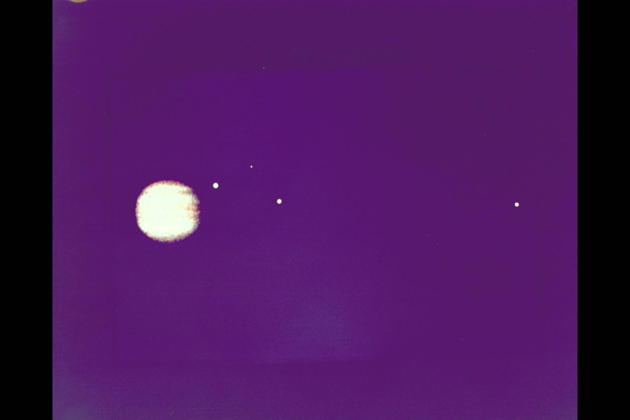 As Voyager 1 approches Jupiter three of its moons can be seen JPL ref. No. C-206
