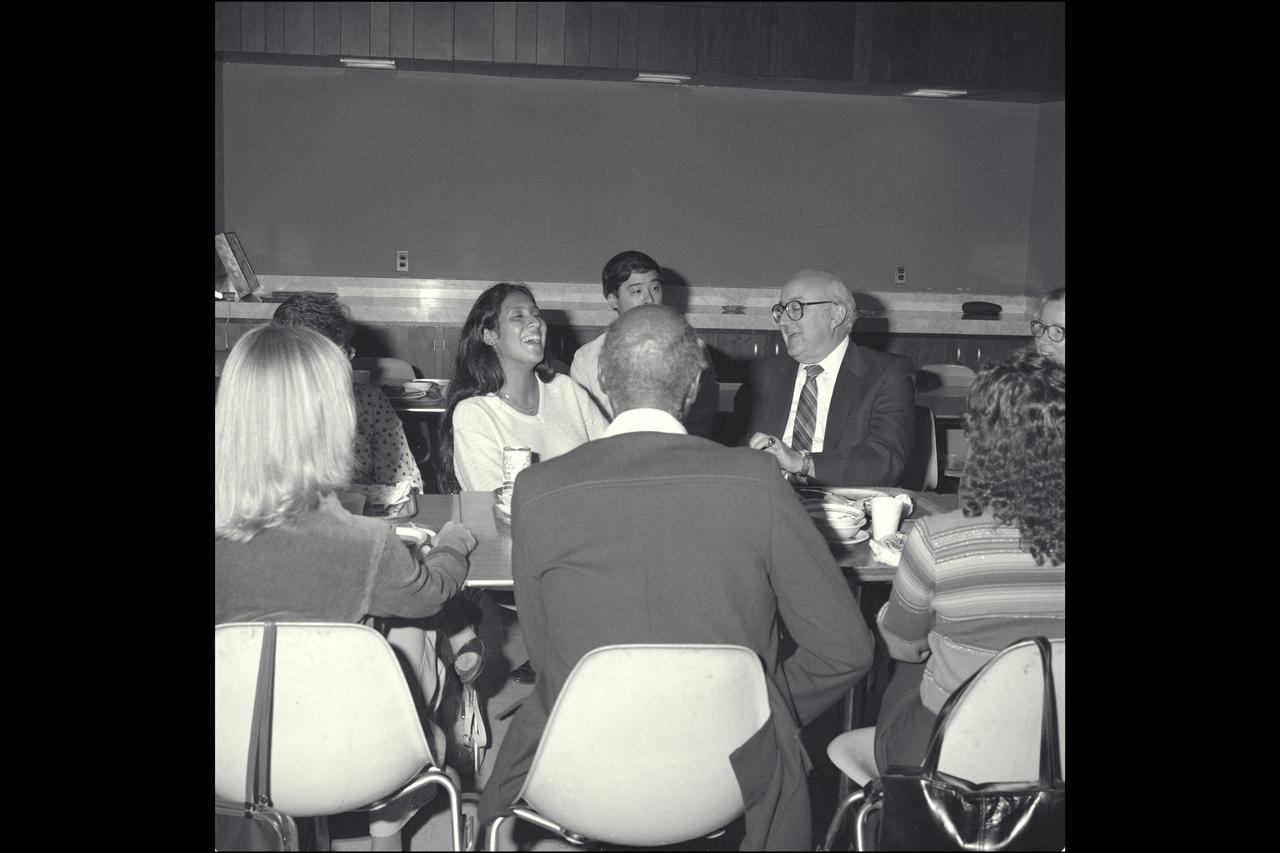 Ames Center Director Sy Syverston enjoys a moment with fellow employees during Ames Heritage Week lunch.
