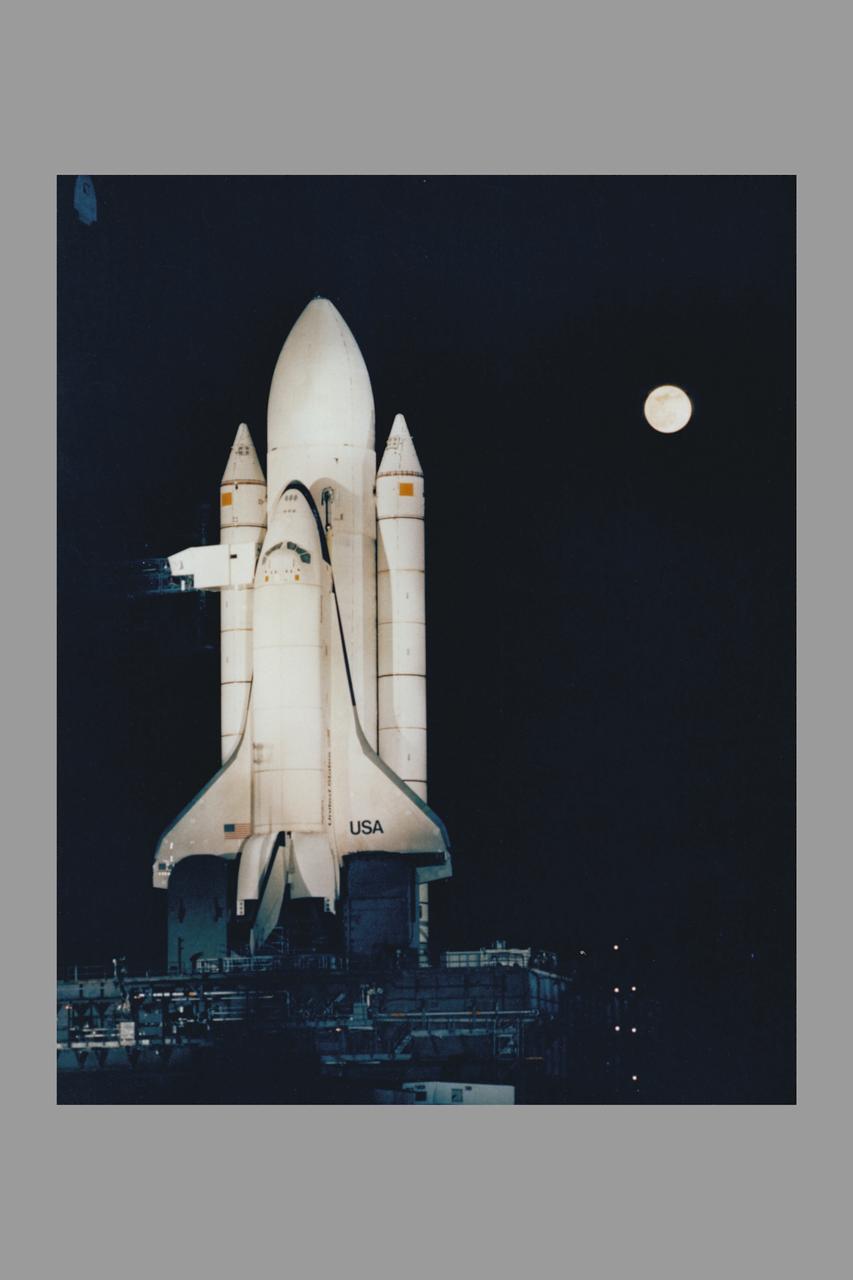 The Space Shuttle 'Enterprise' stands on Kenndey Space Center Pad 39A highlighted against the darkened Florida sky during testing of the high-intensity lighting system. The banks of xenon lights are used during lanuch preparations.