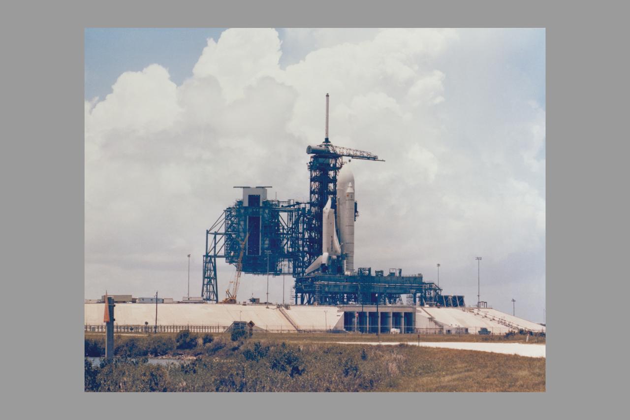 SPACE SHUTTLE ORBITER ENTERPRISE MATED TO AN EXTERNAL FUEL TANK AND TWO SOLID ROCKET BOOSTERS ON TOP OF A MOBIL LAUNCHER PLATFORM, UNDERGOES FIT AND FUNCTION CHECKS AT THE LAUNCH SITE FOR THE FIRST SPACE SHUTTLE AT LAUNCH COMPLEX 39'S PAD A.  THE DUMMY SPACE SHUTTLE WAS ASSEMBLED IN THE VEHICLE ASSEMBLY BUILDING AND ROLLED OUT TO THE LAUNCH SITE ON MAY 1 AS PART OF AN EXERCISE TO MAKE CERTAIN SHUTTLE ELEMENTS ARE COMPATIBLE WITH THE SPACEPORT'S ASSEMBLY AND LAUNCH FACILITIES AND GROUND SUPPORT EQUIPMENT, AND HELP CLEAR THE WAY FOR THE LAUNCH OF THE SPACE SHUTTLE ORBITER COLUMBIA.