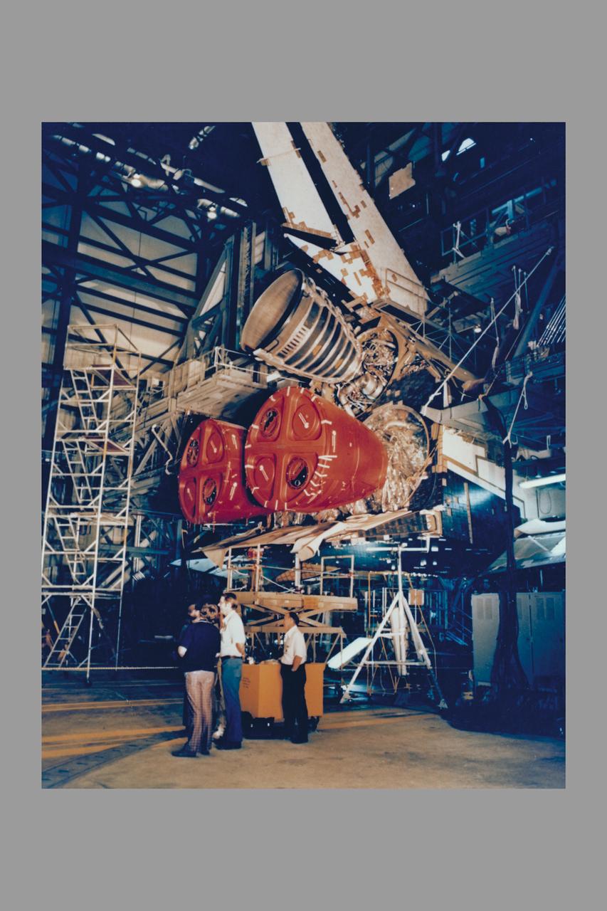 Outfitting the Space Shuttle Orbiter Columbia with the three main rocket engines that will boost the 75 ton spacecraft into orbit on its first flight is completed with the installation of Engine #2007 (top). At liftoff, each engine will be producing about 375,000 pounds of thrust, or about 12 million horsepower each, and gulping down its liquid oxygen and liquid hydrogen propellants at a rate of about 1,100 pounts per second. The Shuttle's main engines, the most efficient rocket engines ever built, are reusable and designed t operate over a life span of 55 missions.