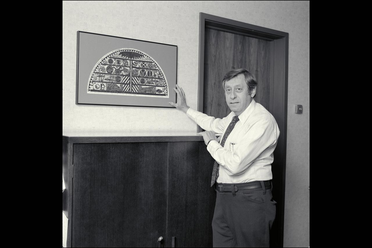 Dr Harold Klein, Director of Life Science in his office at Ames Research Center showing his painting of Indian folklore on the origin of life.