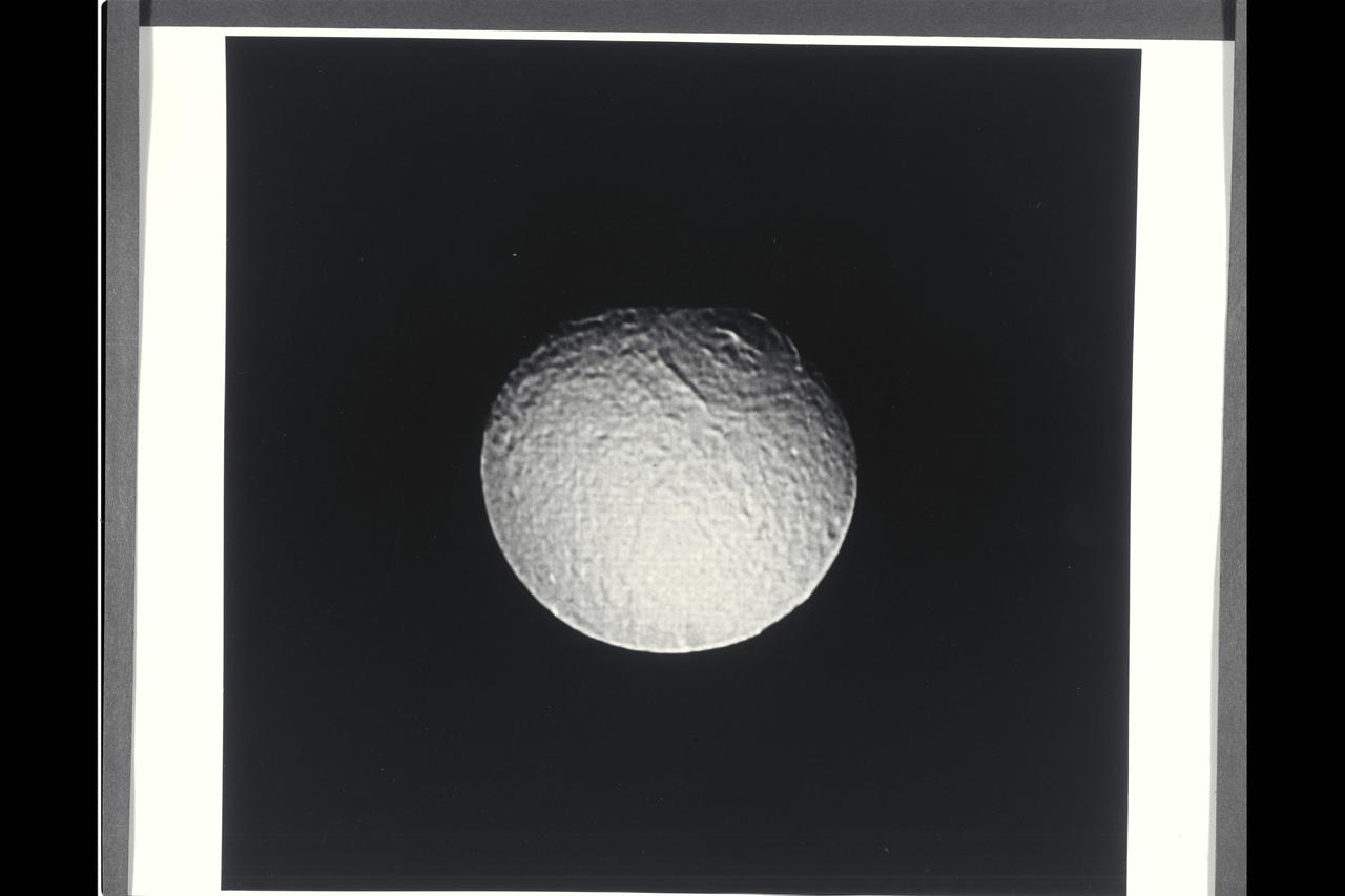 This photograph is a Voyager 2 image of one of the moons of Saturn.