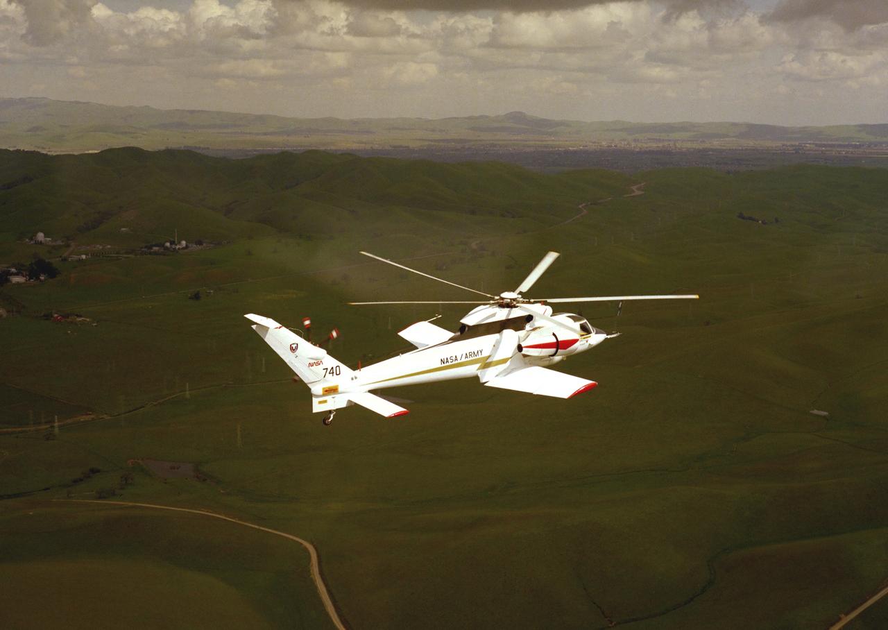NASA Ames Sikorsky Rotor Systems Research Aircraft (RSRA) NASA-740 in flight out of Ames over east foothill of the Silicon Valley, CA