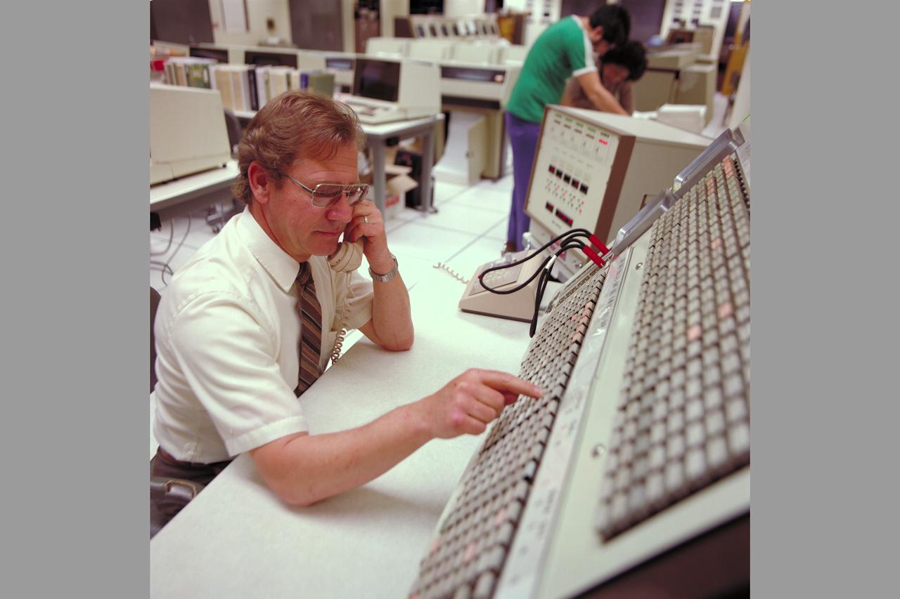 Pioneer Mission Control Center with personnel monitoring spacecraft (PMOC)