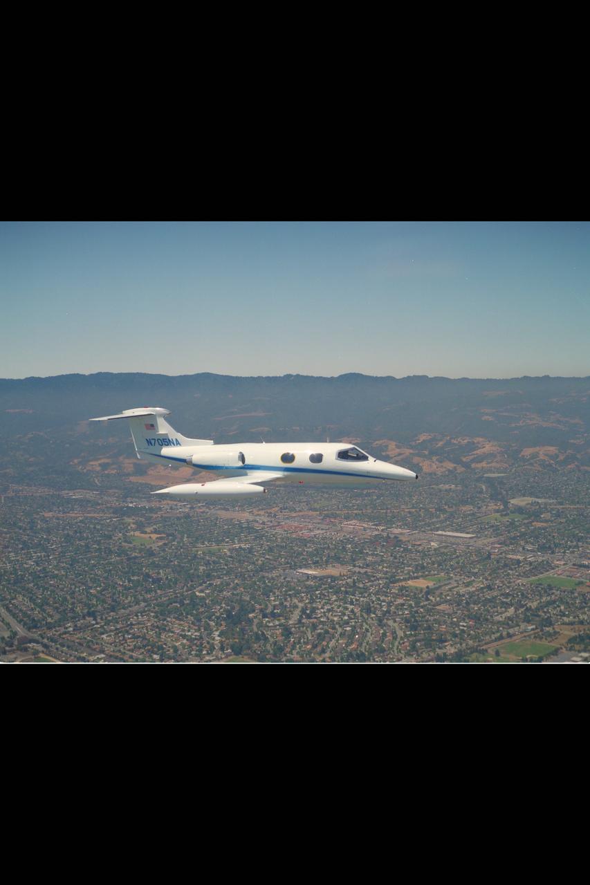 Lear Jet (NASA 705) in flight over Central CA.