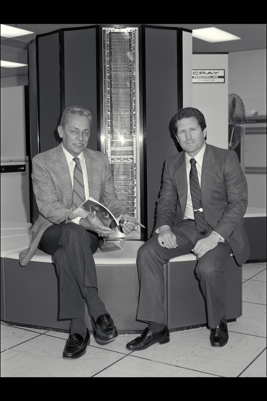 N-233 Cray Computer Ames Director Bill Ballhaus seated with Stan Miller in front of the Cray Computer in N-233
