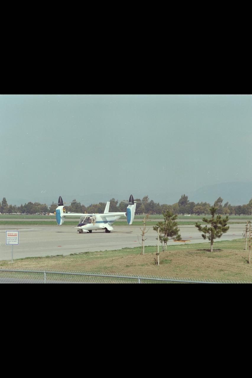 XV-15 (NASA-703) Evaluation Flight @ Ames; Above Title and Helicopter Mode from East Side Runway