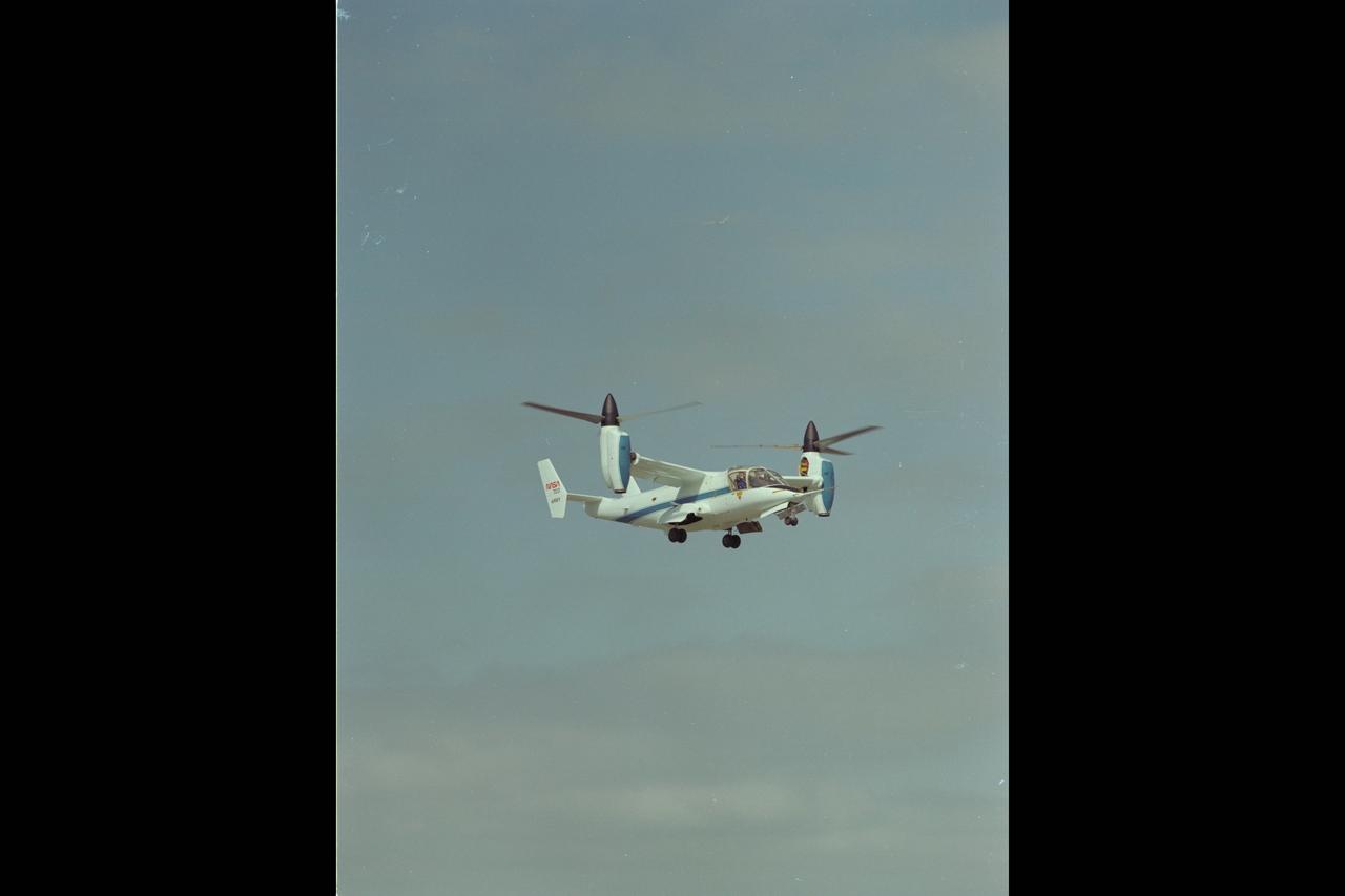 XV-15 Tilt Rotor (NASA-703) hovers at Ames Research Center, helicopter mode