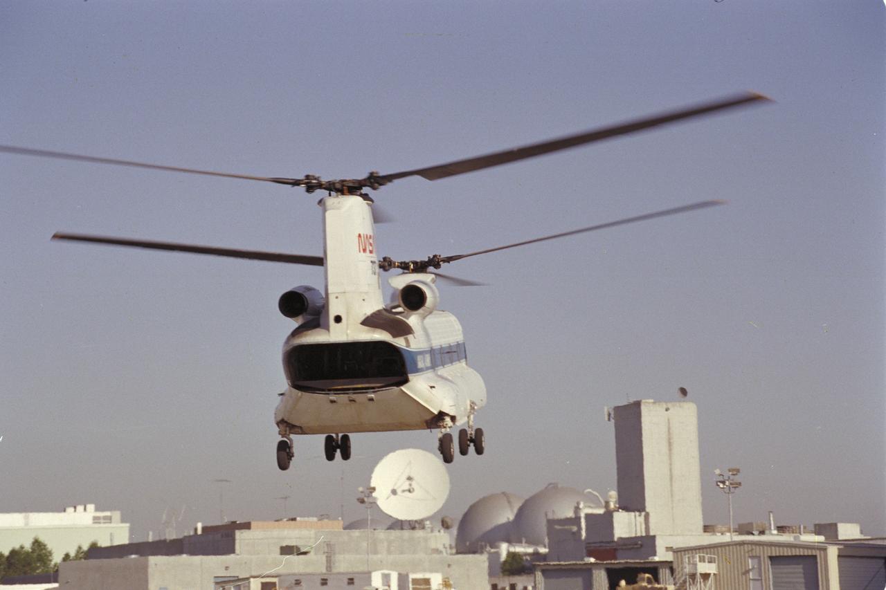 CH-47B (NASA-737) in flight over Moffet Air Field showing rearend.