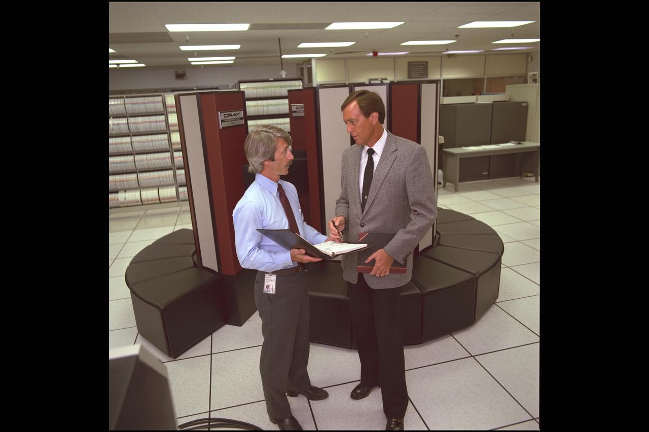 Cray 550 Computer installed in N-233 with B Rosen and Dr. Paul Kutler. Dr. Kutler (right) guided much of Ames' work in computaitonal fluid dynamics used in Ames 60 yr. History NASA SP-2000-4314