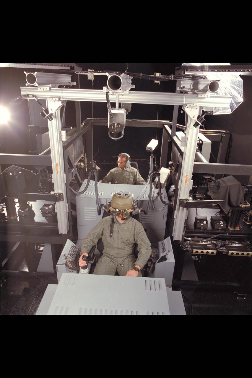 Crew Station Research and Developement Facility (CSRDF) A NASA Army simulator to design and evaluate advanced rotorcraft showing fiber optic helmet & workstation