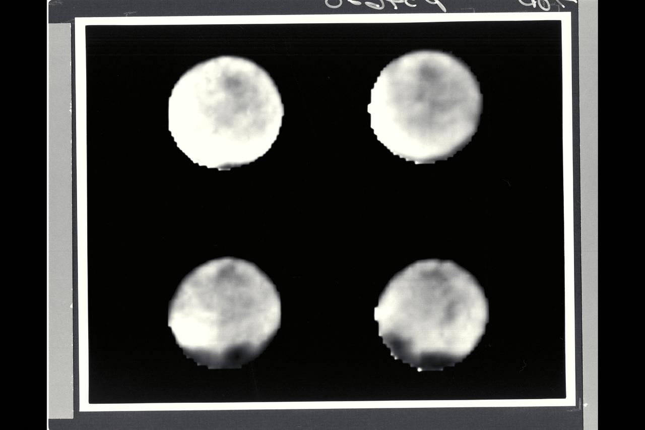 August 17 to 19, 1989 Range : 11.5 million km (7.1 million mi.) to 7.9 million km (4.9 million mi.) Four black and white images of Neptune's largest satellite, Triton, show it's rotation between the first (upper left) image and the last (lower right). Resolution improves from about 200 km (124 miles) to 150 km (93 miles) per line pair. Triton's south pole lies in the dark area near the bottom of the disk. Dark spots, roughly 1,000 km (620 miles) across, occur near the equator, and show Triton rotation between images. The rotation appears to be synchronous with Triton's 5.88-day orbital period (i.e., Triton rotates on its axis in the same time it revolves around Neptune.) The spots' constant rotation rate and their visibility near the edge of the disk suggest the spots are surface features. Whatever atmosphere is present on Triton appears transparent enough that Voyager 2's cameras can see through it.