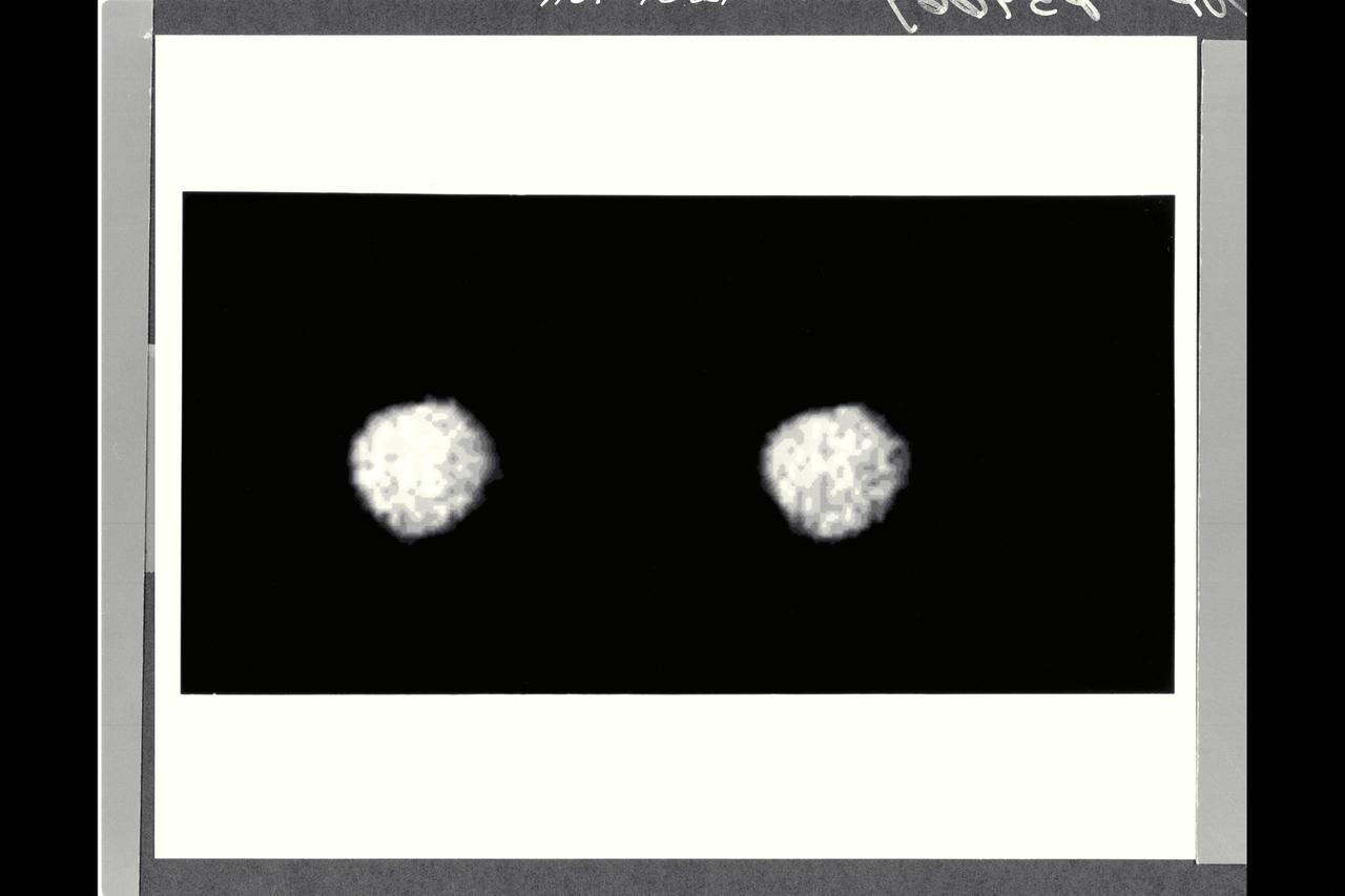 P-34669 Range : 2.6 million km. ( 1.6 million miles ) Smallest Resolvable Feature : 50 km or 31 miles These two Voyager 2 images, shot through clear filters, show the largest of the new moons of Neptune, 1989N1, discovered by Voyager. The satellite, made of dark material that reflects about 6 % of incident sunlight, has an average radius of about 200 kilometers ( 124 miles ) and an irregular shape. Its similiar appearance in the two images shows that the shape seen here is not the result of image noise or smear. This may the largest satellite in the solar system with such an irregular shape. satellite 1989N1 is slightly larger than the previously known small Neptunian moon Nereid but is very much darker.