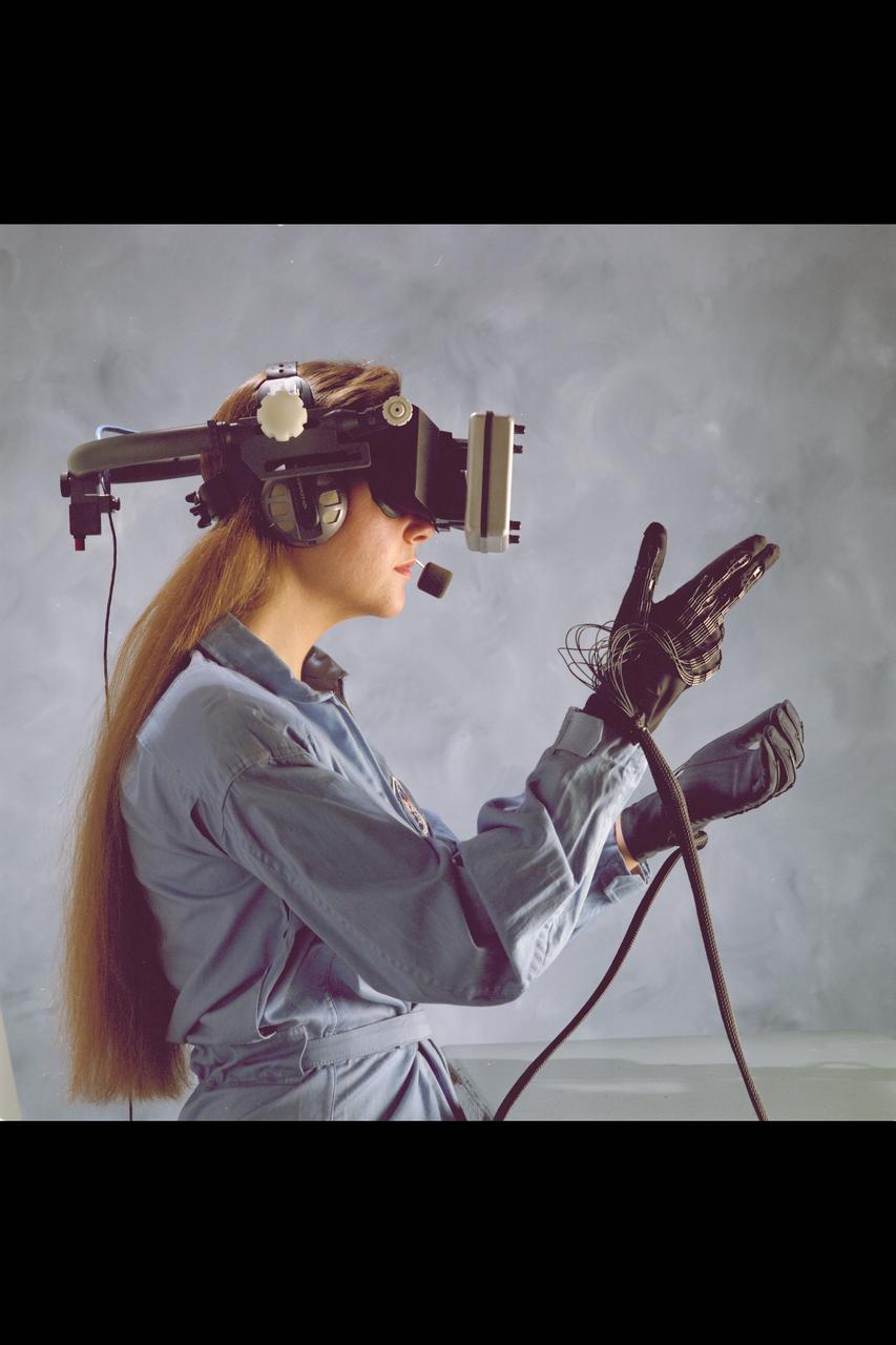 Virtual Environment Reality workstation helmet and gloves