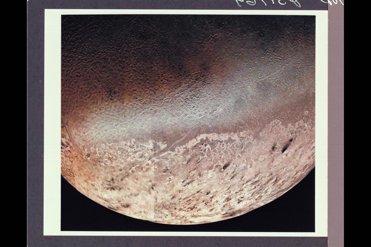 P-34764 Voyager 2 obtained this high resolution color image of Neptune's large satellite Triton during its close flyby. Approximately a dozen individual images were combined to produce this comprehensive view of the Neptune-facing hemisphere of Triton. Fine detail is provided by high resolution, clear-filter images, with color information added from lower resolution frames. The large south polar cap at the bottom of the image is highly refective and slightly pink in color , and may consist of a slowly evaporating layer of nitrogen ice deposited during the previous winter. From the ragged edge of the polar cap northward the satellite's face is generously darker and redder in color. This coloring may be produced by the action of ultraviolet light and magnetospheric radiation upon methane in the atmosphere and surface. Running across this darker region , approximately parallel to the edge of the polar cap, is a band of brighter white material that is almost bluish in color. The underlying topography in this bright band is similiar, however to that in the darker, redder regions surrounding it.
