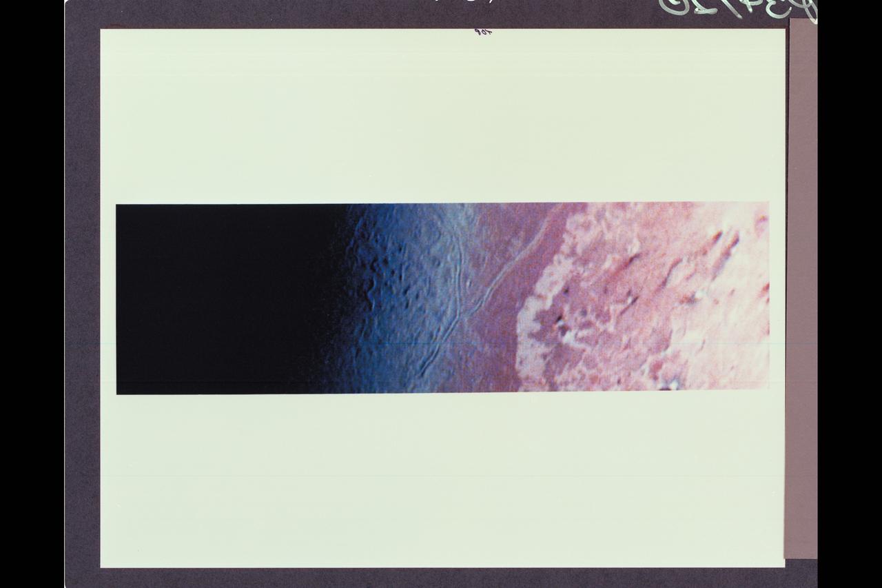 Voyager violet, green and ultraviolet images of Triton were map projected into cylindrical coordinates and combines to produce this false-color terrain map.  Several compositionally distinct terrain and geologic features are portrayed.  At center is a gray-blue unit referred to as 'cantaloupe' terrain because of its unusual topographic texture.  The unit appears to predate other units to the left.  Immediately adjacent to the cantaloupe terrain, is a smoother unit, represented by a reddish color, that has been dissected by a prominent fault system.  This unit apparently overlies a much-higher-albedo material, seen farther left.  A prominent angular albedo boundary separates relatively undisturbed smooth terrain from irregular patches which seem to emanate from circular, often bright-centered features.  The parallel streaks may represent vented particulate materials blown in the same direction by winds in Triton's thin atmosphere.