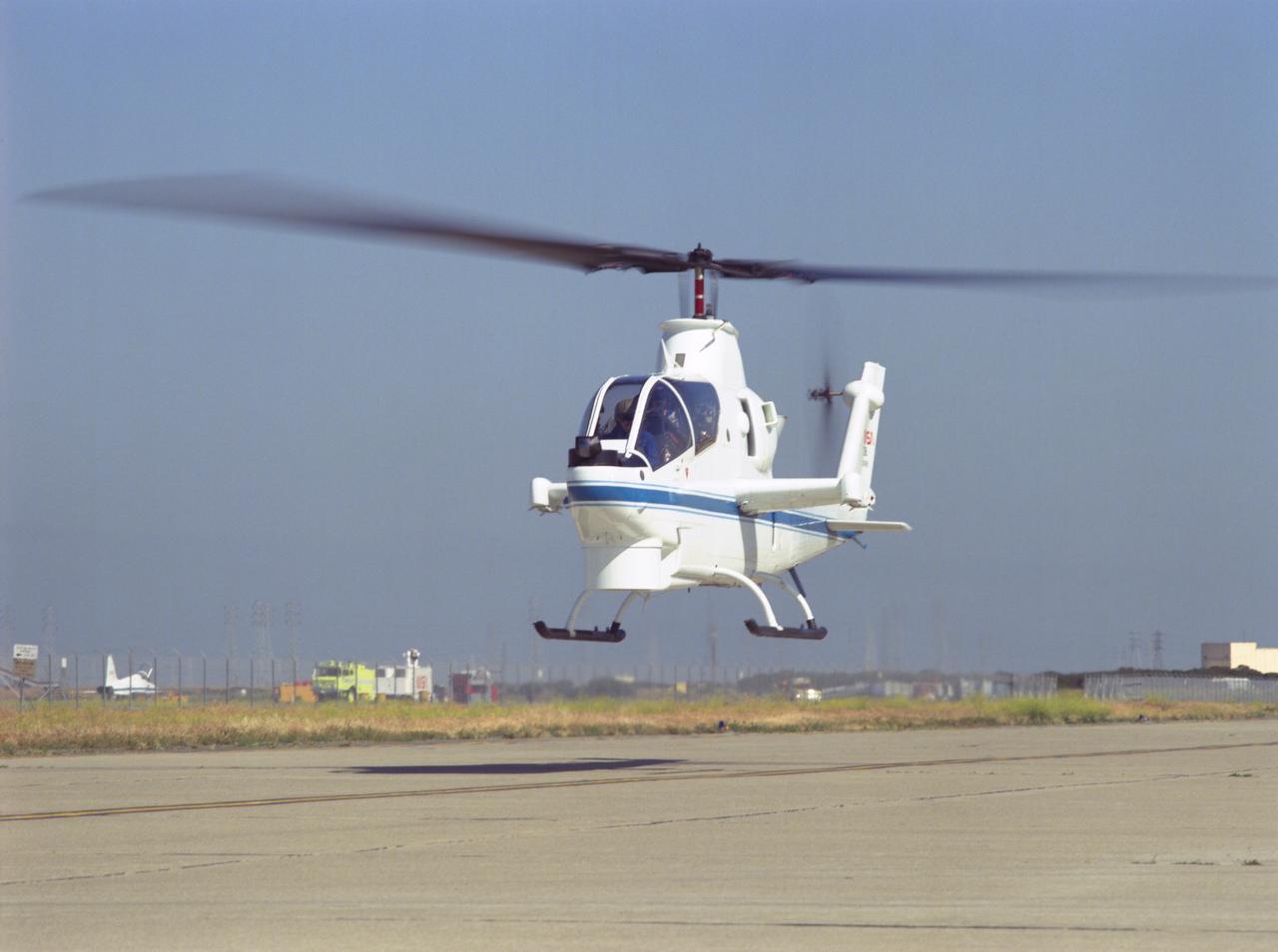 Cobra AH-1G (NASA-736) helicopter hovering on Ames ramp