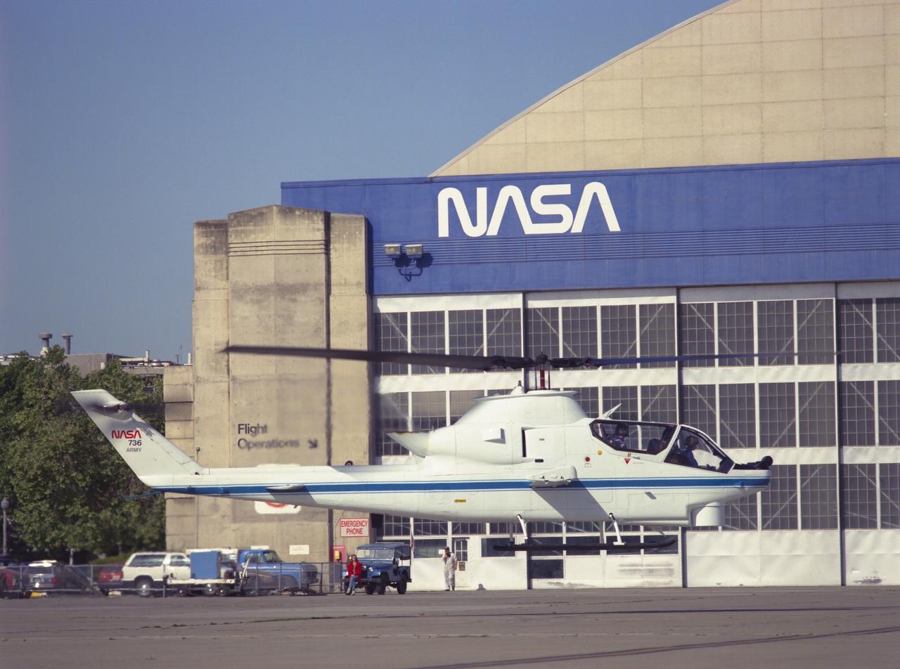 Cobra AH-1G (NASA-736) helicopter hovering on Ames ramp