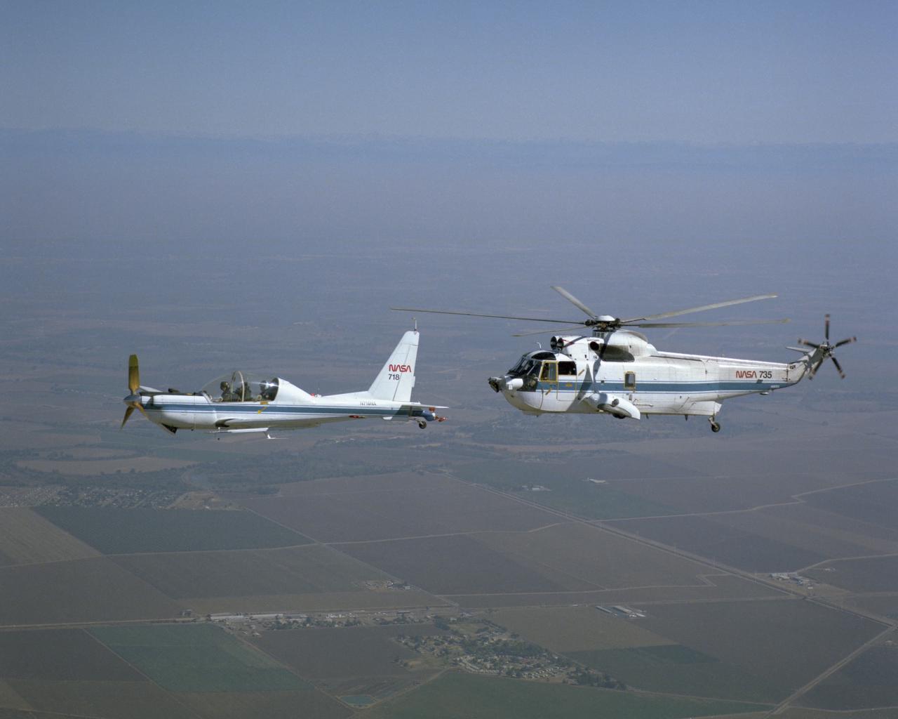 YO-3A (NASA-718) and SH-3G (NASA-735) in flight at Crows Landing during Helicopter Airborne Laser Positioning System